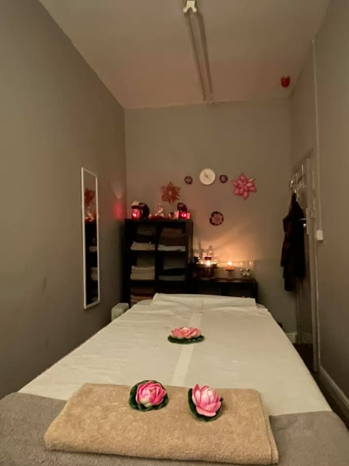 Cozy treatment room with lotus flower decorations